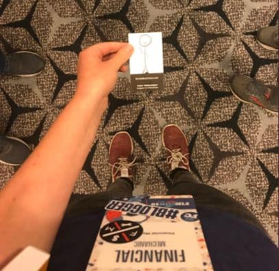 Photo of Financial Mechanic holding Mr. Burrito Bowl's business card at FinCon 2019