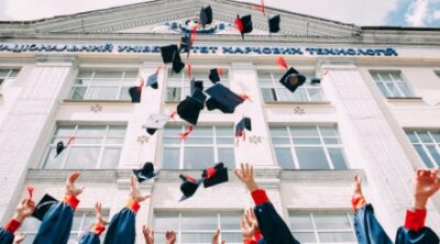 Is a 529 plan worth it image of college students throwing hats into air
