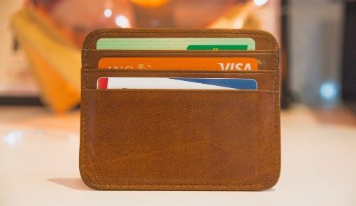 a wallet with credit cards representing how to get a good credit score