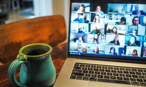 flexible work from home jobs making $20 an hour picture with coffee cup and zoom on screen