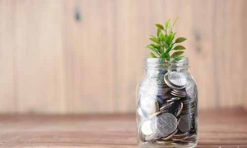retirement security image of money in a jar with a sprout