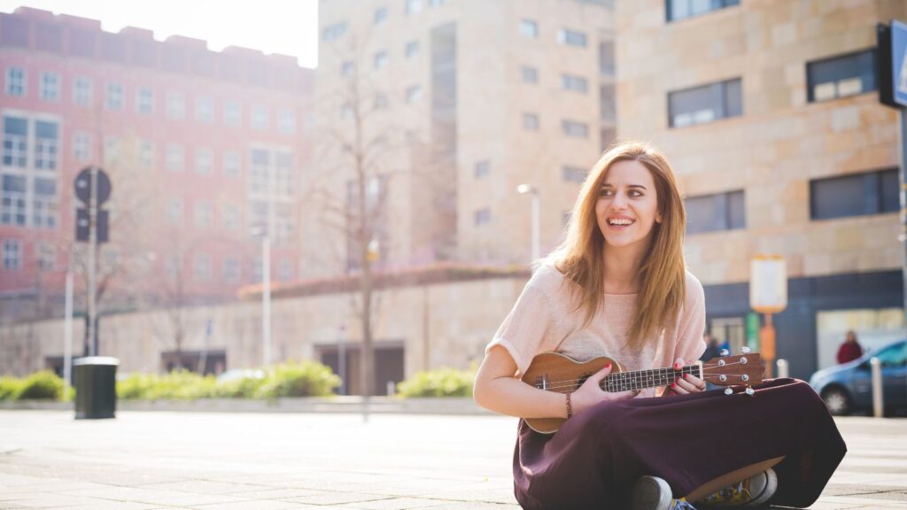 photo of young woman busking