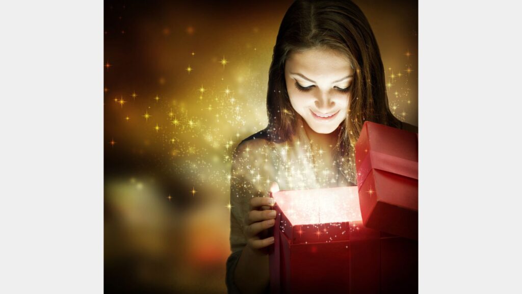 Girl opening Christmas gift