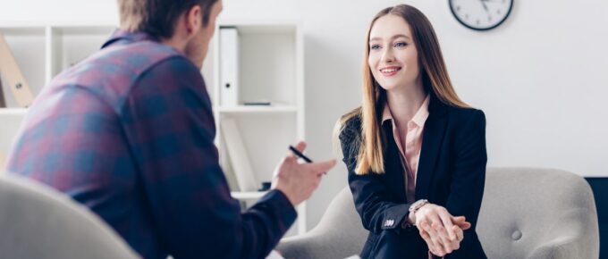 Man interviewing woman for job