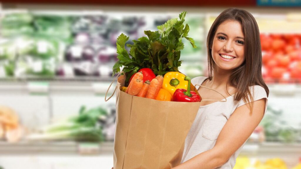 Woman holding bag of groceries