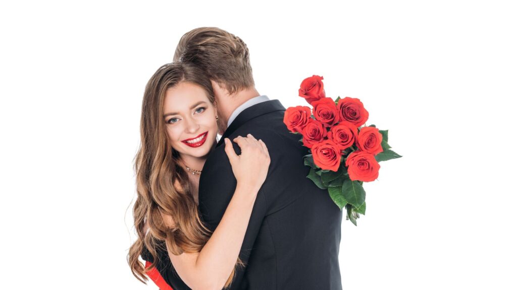 Woman hugging man holding expensive flowers