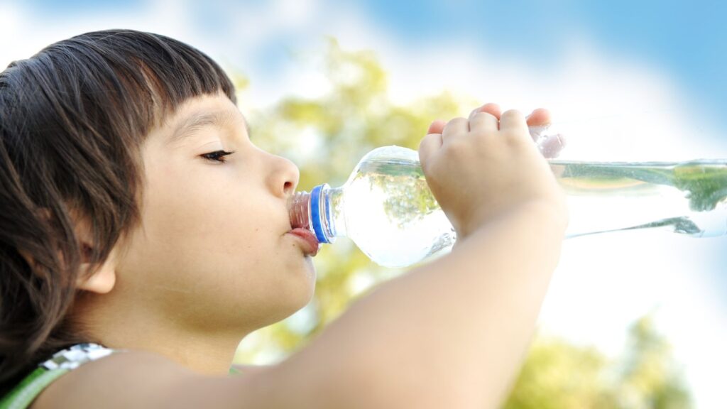 Girl drinking bottled water